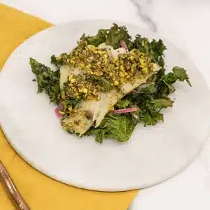 pistachio crusted cod with roasted kale and red onions