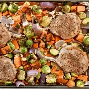 sheet pan pork chops, sweet potatoes, and brussels sprouts